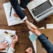 Shaking Hands In Formal Setting Featured Image